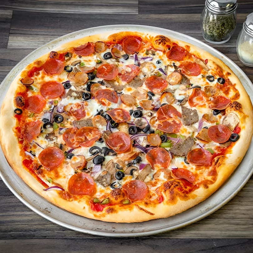 Bianco's Italian Cuisine's fully loaded pizza with pepperoni, sausage, olives, and vegetables.